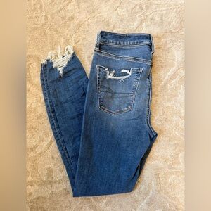 American Eagle Outfitters Dark Blue Skinny Jeans with Distressed Hem